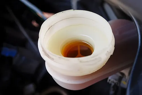 Brake Fluid Turns Dark Quickly: Moisture, Rubber Debris, or Old Reservoir Contamination?