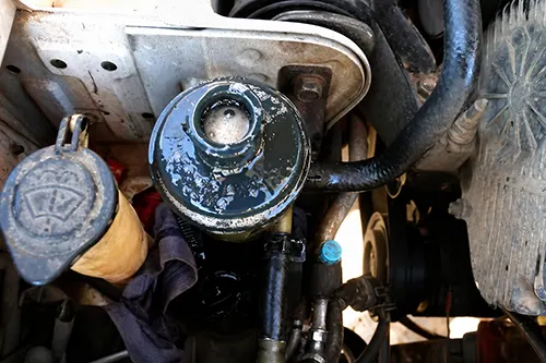 Power Steering Fluid Looks Foamy: Air Ingress, Low Level, or Return-Line Leak—How to Check Safely